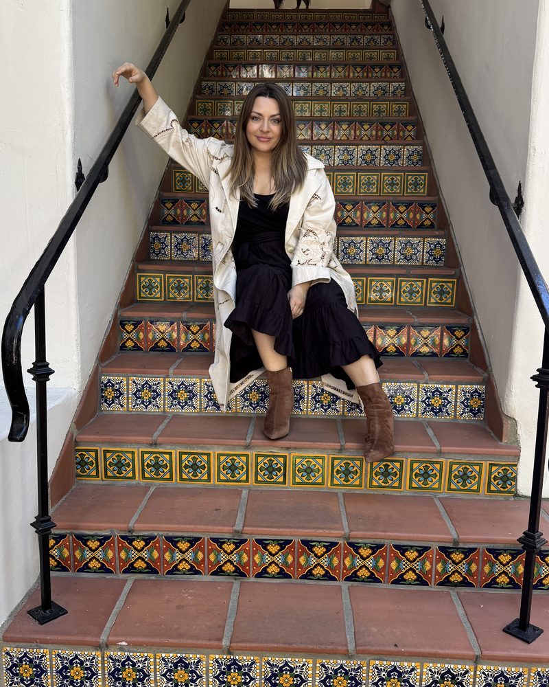 Delfina Alden on a tiled staircase
