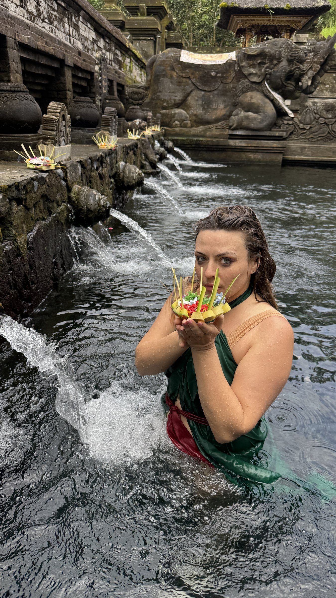 Delfina in the spring water at a Balinese temple