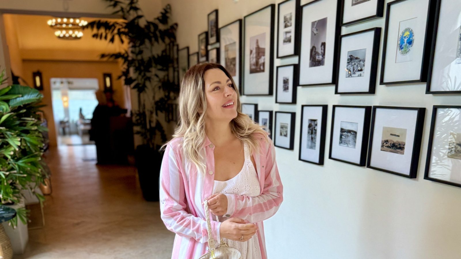 Delfina in a gallery hallway